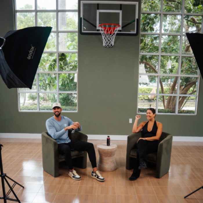 Victoria Shahbaz, founder of Joy Dealers, with Michael Raymond of Raymond Representation discussing athlete philanthropy and community initiatives.